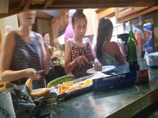Family Cooking in a Rental Home