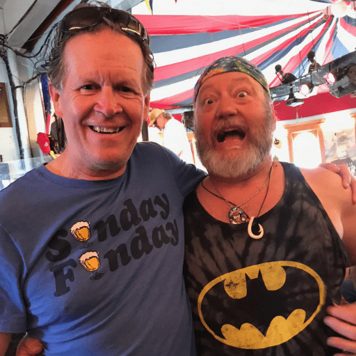 9 Downtown Dave Schafer and famous Put-in-Bay musician Mike "Mad Dog" Adams, posing together for a photo in the Round House Bar at Put-in-Bay