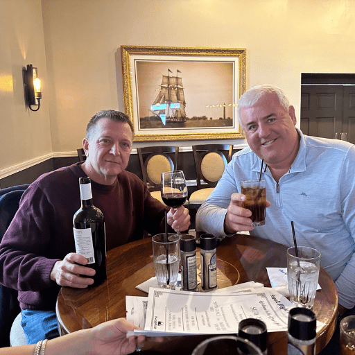 1 Brad Ohlemacher and Bryan Kasper enjoying drinks together in a Put-in-Bay restaurant.