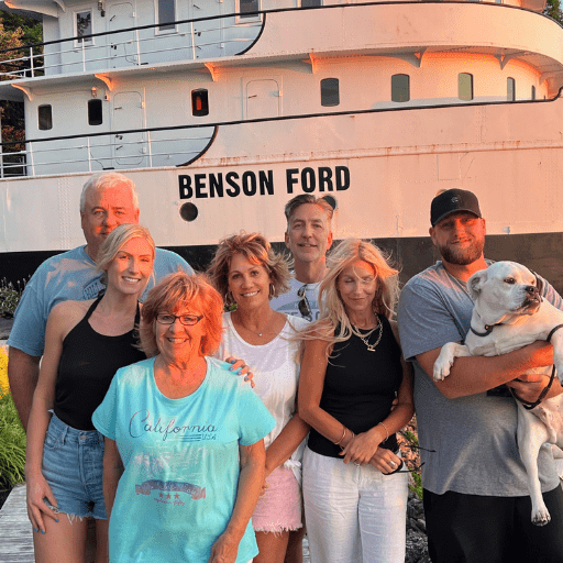 7 Bryan Kasper posing with family in front of the Benson Ford Ship House.