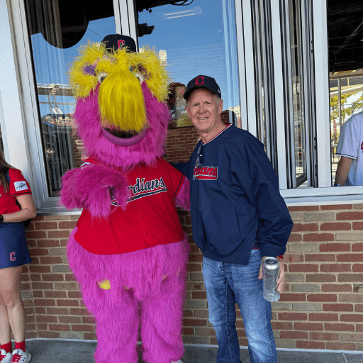 6 Downtown Dave Schafer posing with Cleveland Guardians mascot Slider.