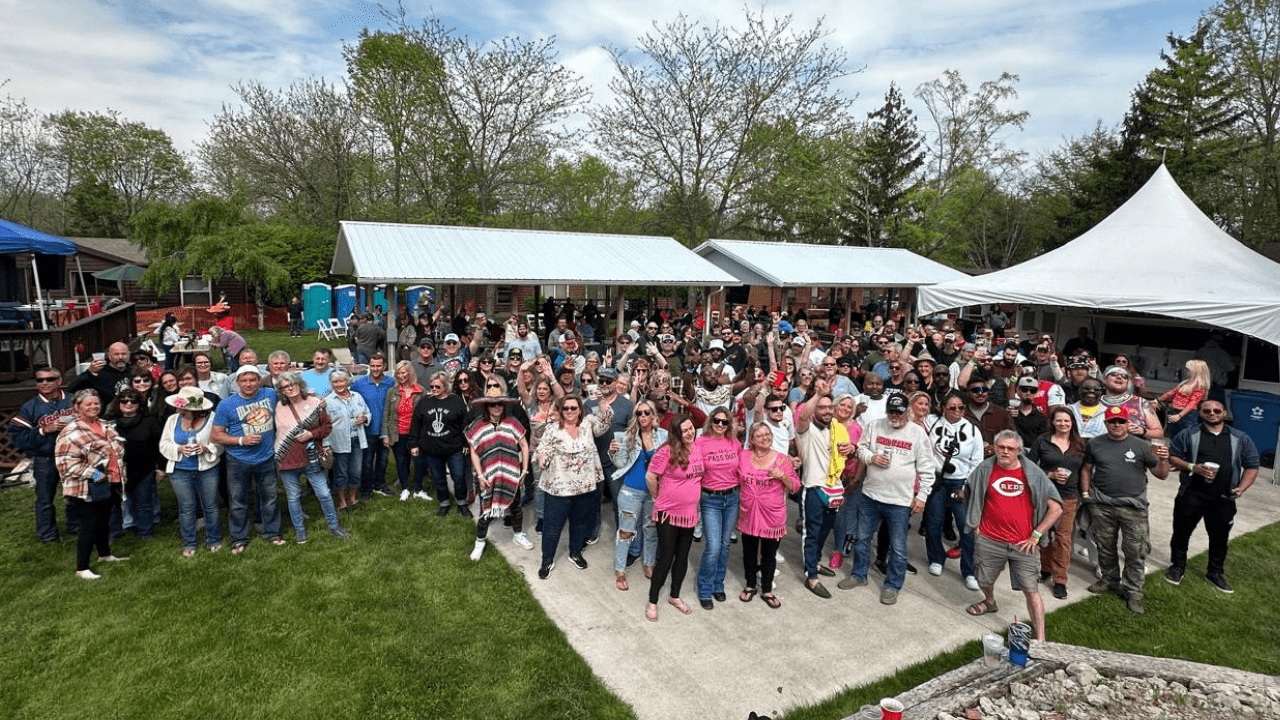 1 A huge group posing for a picture at Spring Fling at the Island Club pavilion.