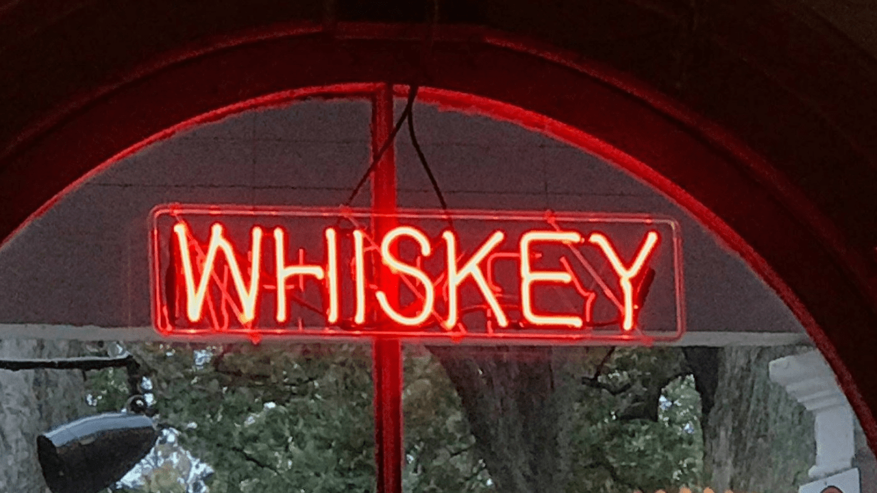 1 A close up of the Whiskey Light shining in the Round House Bar Winow